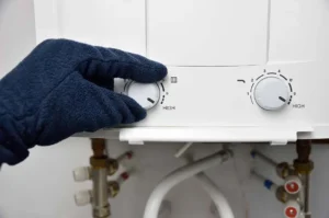 Adjusting the heat of a tankless hot water heater. Call RJ Plumbing in Battle Ground to install a tankless hot water heater.
