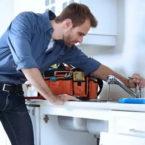 An RJ Plumbing Services technician tests a sink after installing a new fixture. Call RJ Plumbing Services if you need help installing sink or bathroom fixtures.