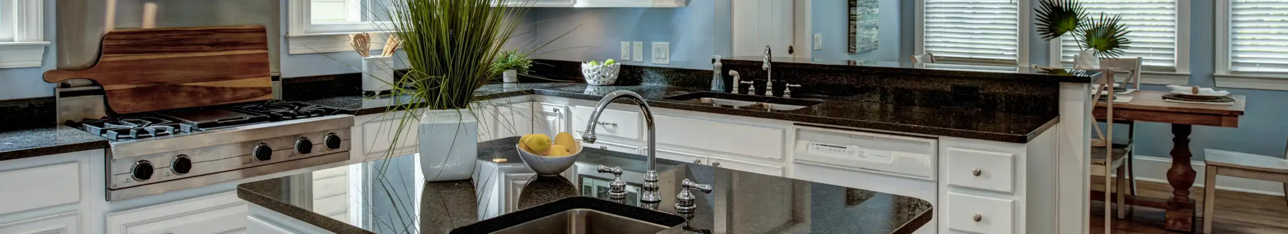 A modern kitchen after a remodel. Call RJ Plumbing Services if you're planning a kitchen remodel, and find out if your plumbing can support your new layout and fixtures.